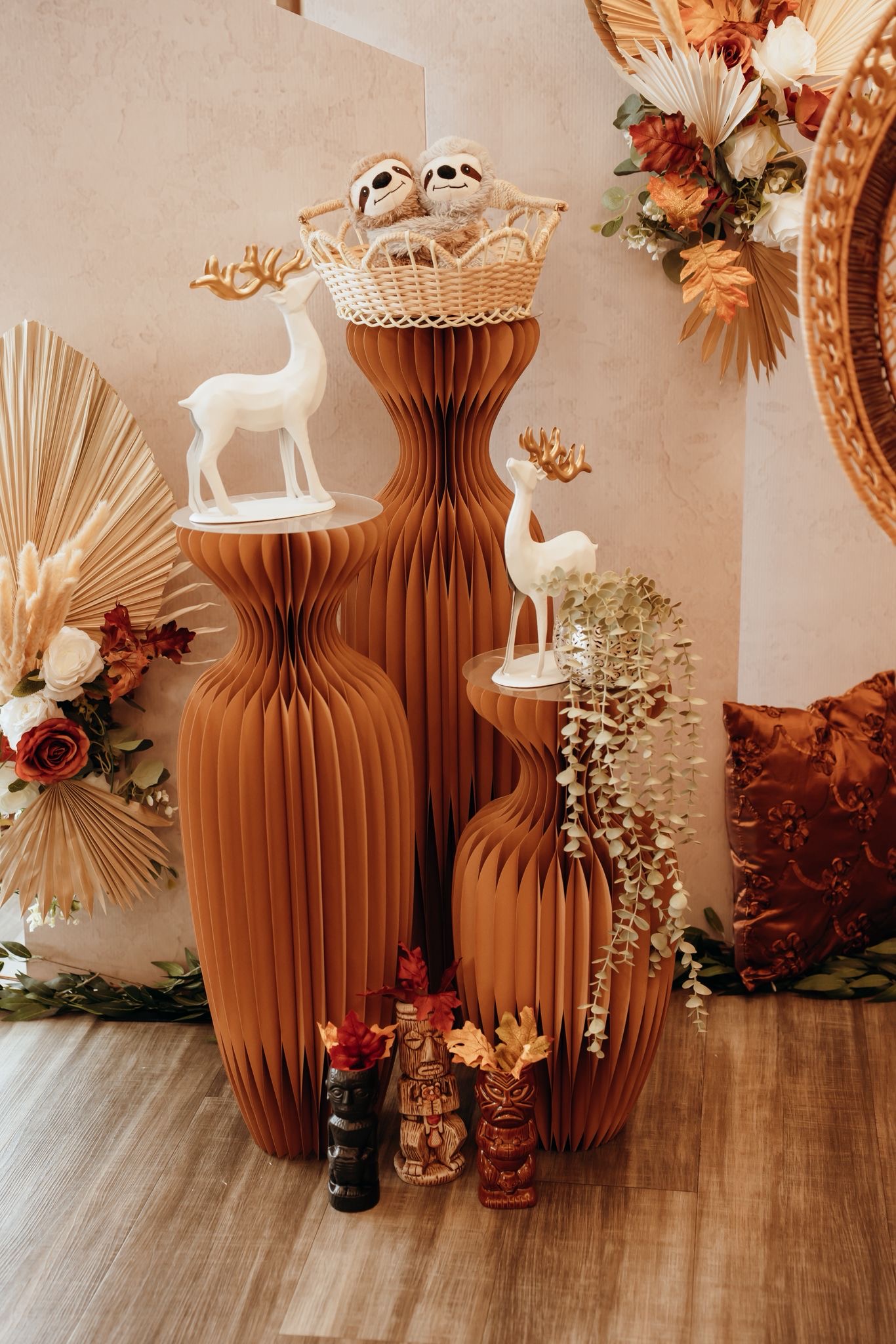 Terracotta paper pedestals with deer figurines