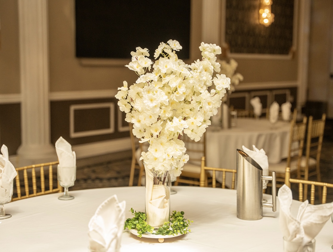 White cherry blossom centerpiece on round table