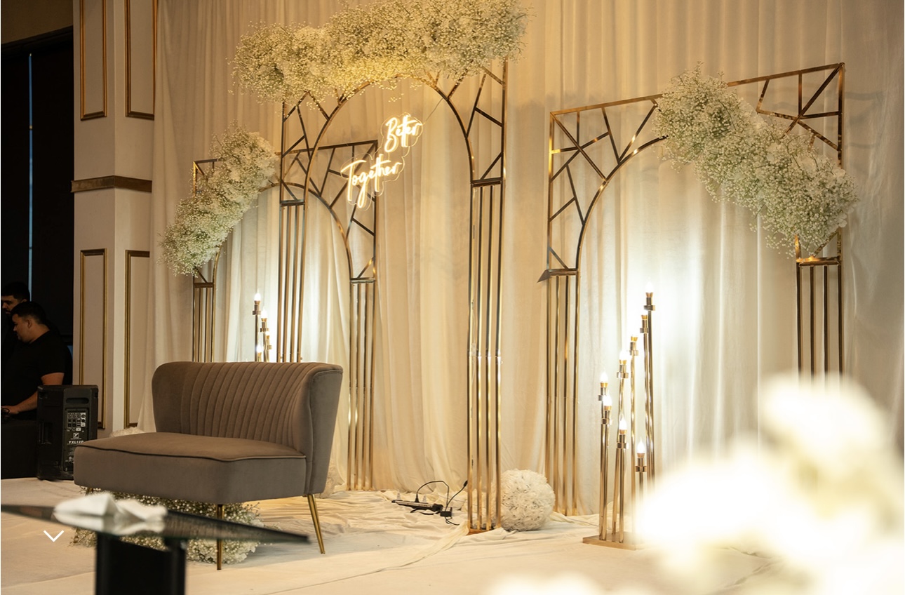Better Together gold arch reception stage