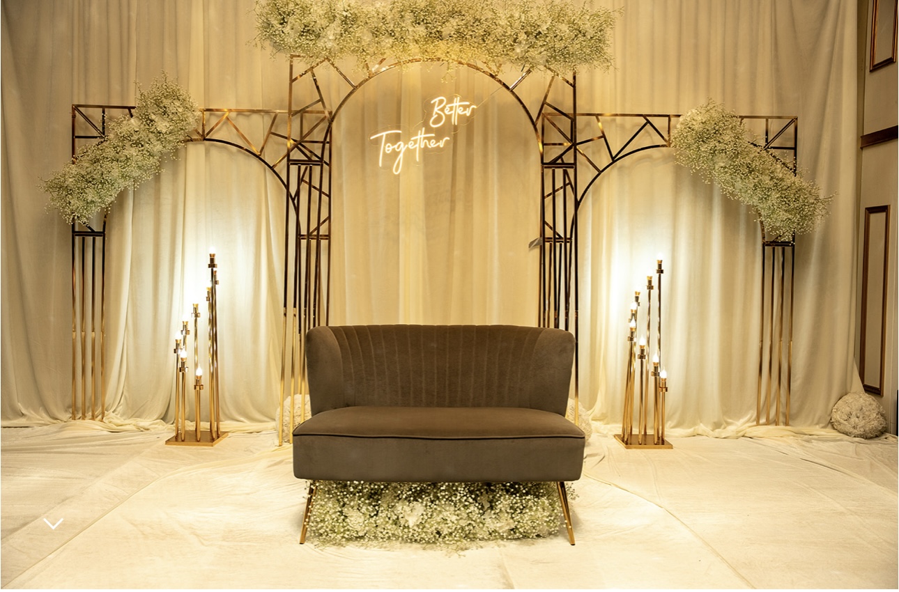 Better Together gold arch with babys breath