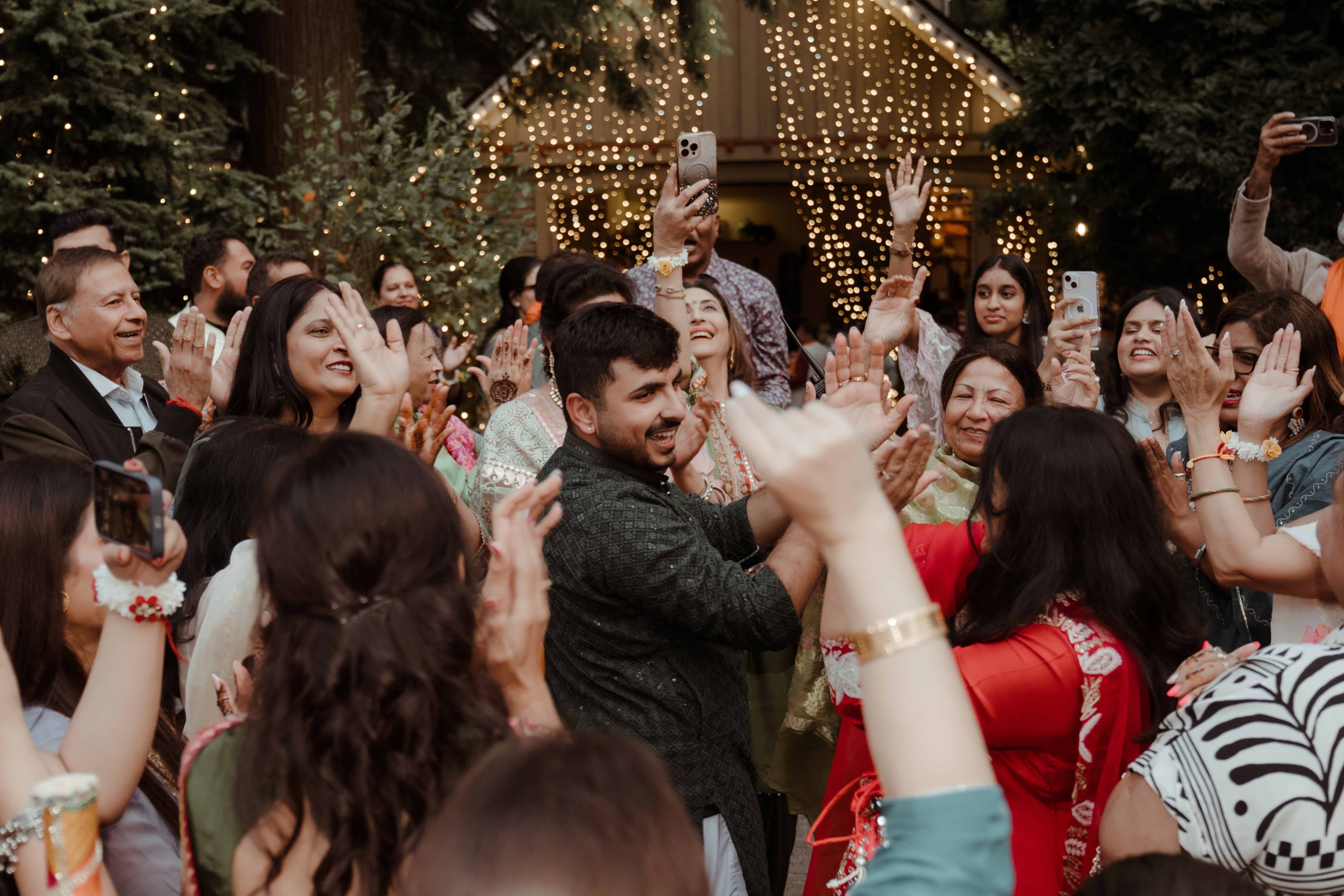 Nitesh celebrating with families on the dance floor